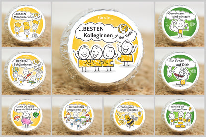Neun silber verpackte Schokotaler mit verschiedenen Strichmännchen-Motiven und wertschätzenden Sprüchen